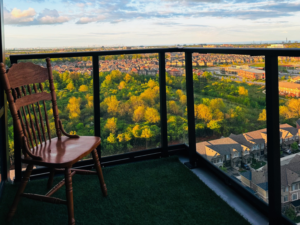 a chair standing on a grass flor looking at the view over ontario toronto vishmith blog